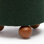 Sgabello imbottito Bouclé con gambe in legno massello