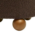 Sgabello imbottito Bouclé con gambe in legno massello